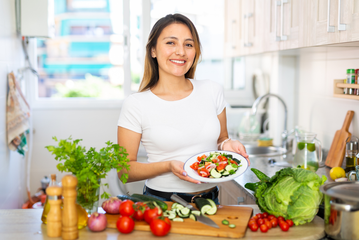 Portrait Of Young Latino Woman With Fresh Salad