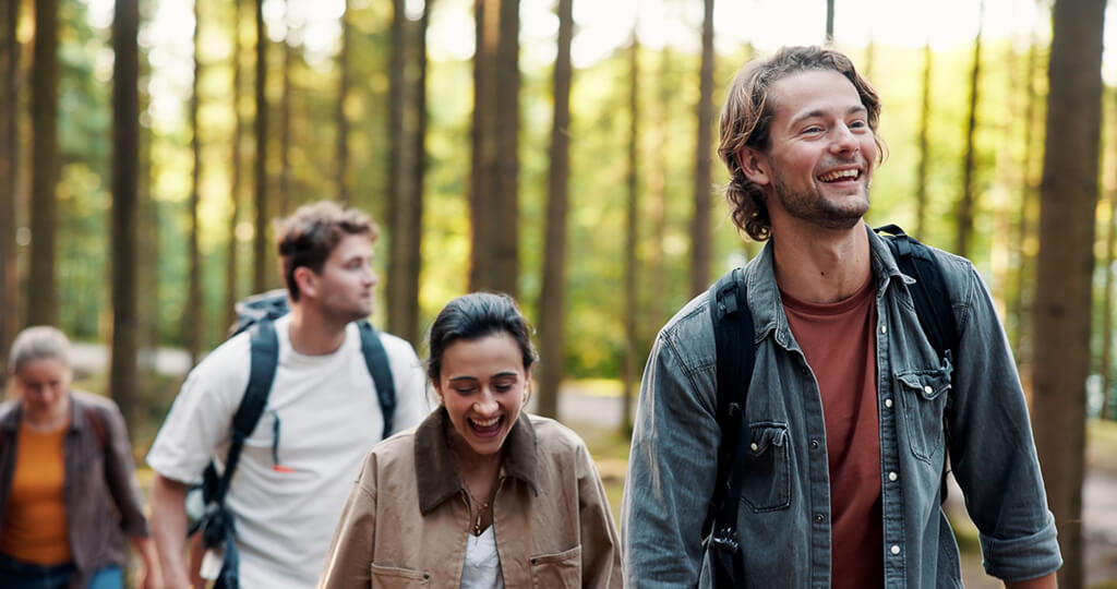 A group of people hiking in a forest
