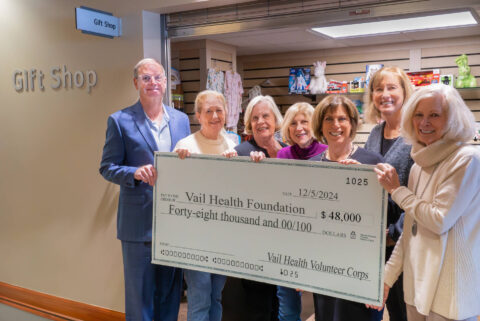 The Vail Health Volunteer Corps presents a $48,000 check to Vail Health Foundation.