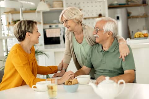 Family discussing advance directive planning at home.
